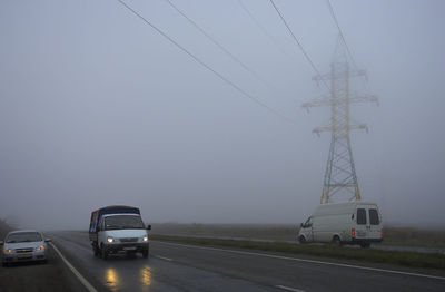 Cars on road against sky