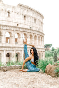 Woman against historic building