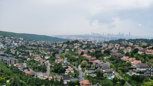 High angle view of buildings in city against sky