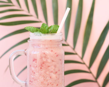 Close-up of drink against wall