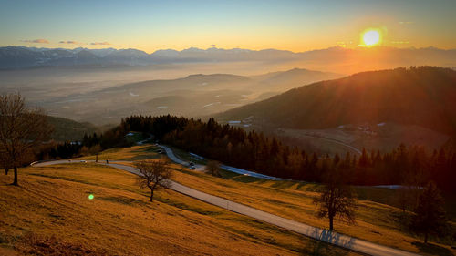 Scenic view of landscape against sky during sunset