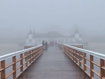 Pier over sea against clear sky