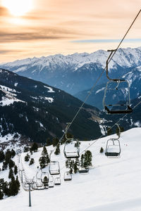 Ski lift against mountains during winter