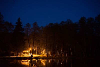 Scenic view of river against sky at night