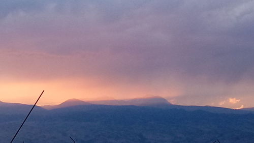 Scenic view of mountains against sky during sunset