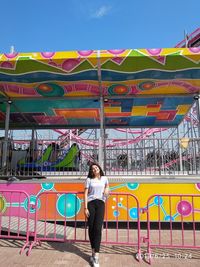 Full length of woman standing at amusement park