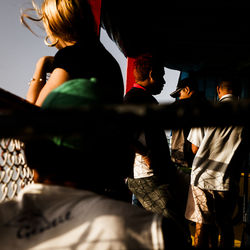 Rear view of people walking in corridor