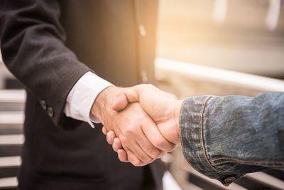 Close-up of business people shaking hands