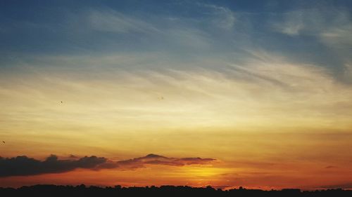 Scenic view of landscape at sunset