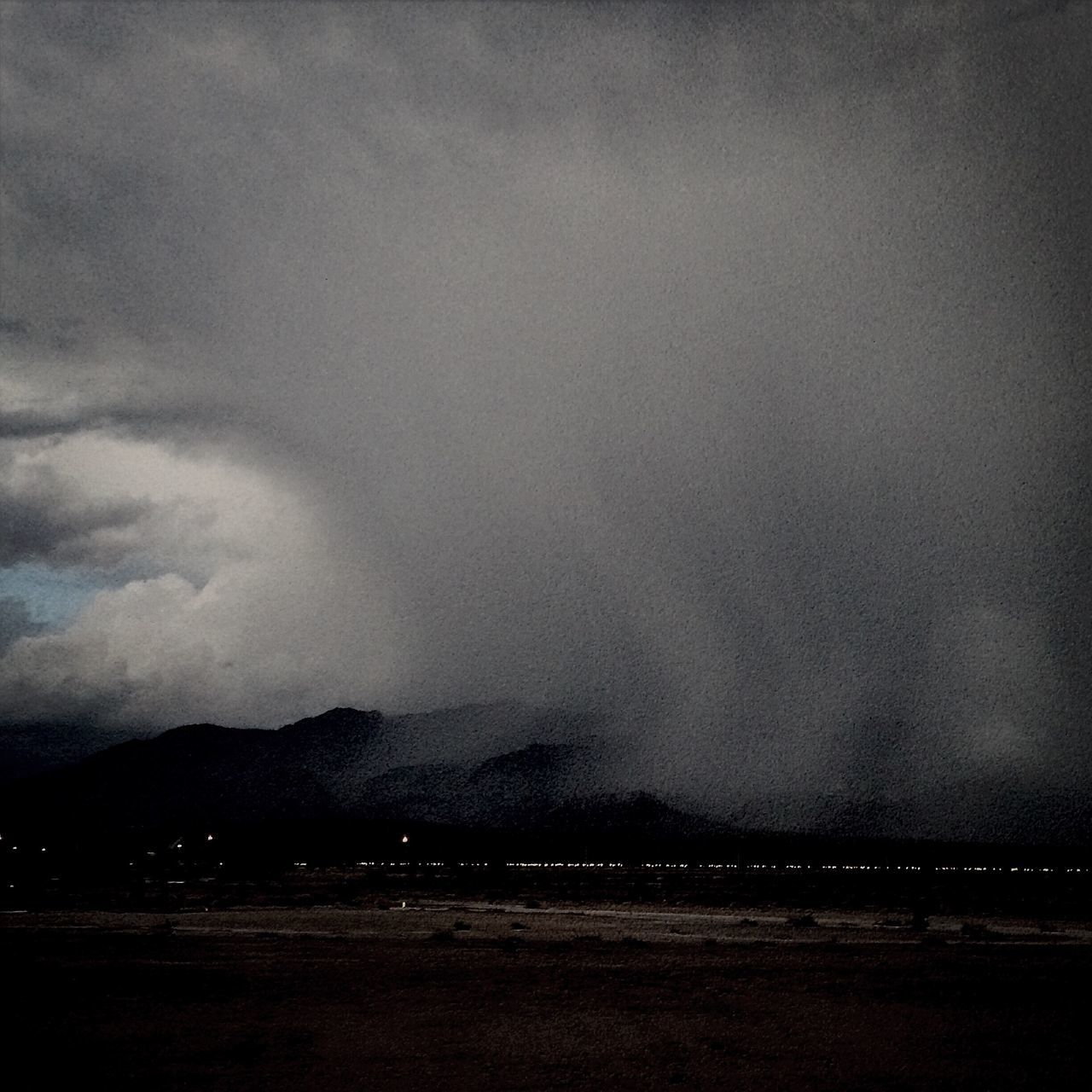 sky, scenics, tranquility, tranquil scene, mountain, weather, beauty in nature, night, landscape, cloud - sky, nature, dusk, cloudy, overcast, idyllic, storm cloud, outdoors, mountain range, no people, non-urban scene