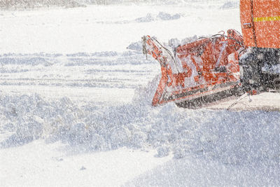 Man on snow covered land