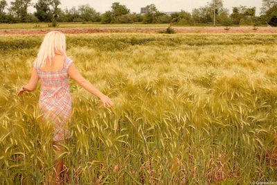 Woman standing in field