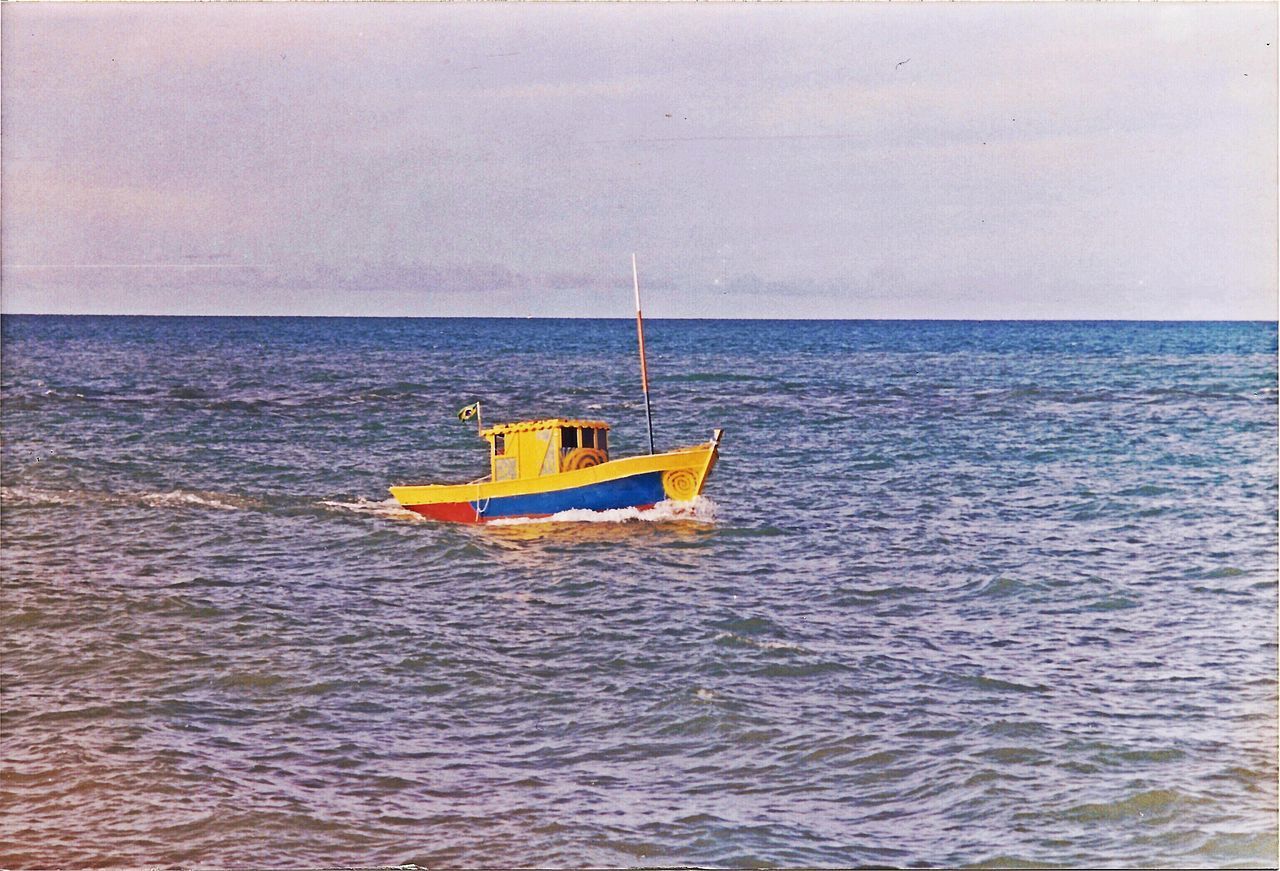 SAILBOAT ON SEA AGAINST SKY