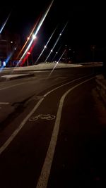 Light trails on road in city at night