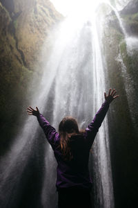 Man with arms outstretched in water