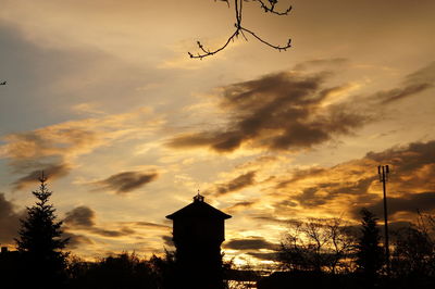 Low angle view of silhouette trees against sky during sunset