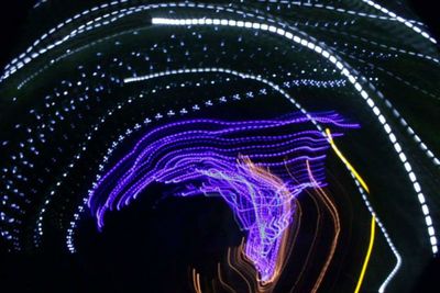 Low angle view of illuminated ferris wheel