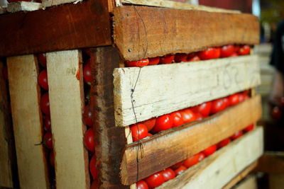 Close-up of tomatos in wooden box
