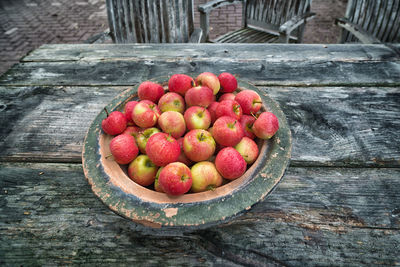 High angle view of apples in container on table