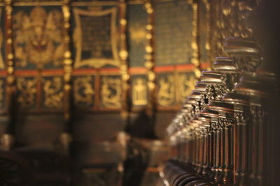 Close-up of lit candles in temple