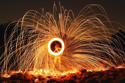 Wire wool against sky at night