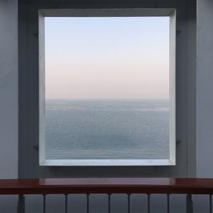 Scenic view of sea seen through window