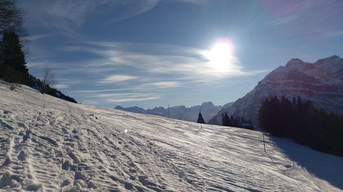 Scenic view of landscape against sky during winter