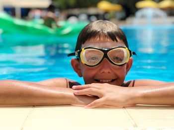 Portrait of mature man swimming in pool