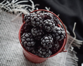 High angle view of raspberries in bowl on table