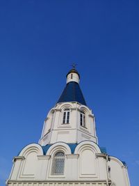 Low angle view of church against blue sky