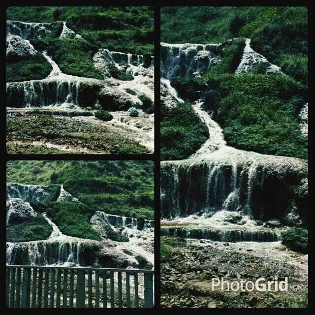 transfer print, auto post production filter, rock - object, water, nature, stone, day, tranquility, tree, outdoors, tranquil scene, beauty in nature, text, scenics, no people, rock, stone - object, western script, grass, stone wall