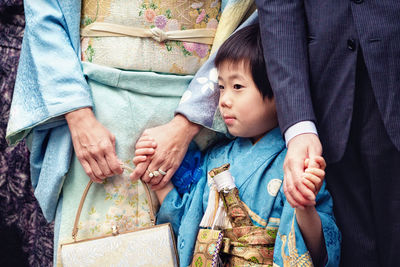 High angle view of couple holding hands