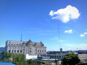 Low angle view of buildings against blue sky