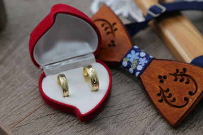 High angle view of wedding rings on table