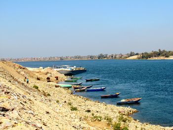 Sailboats moored on nile river  against clear sky