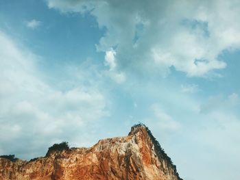 Low angle view of rock against sky