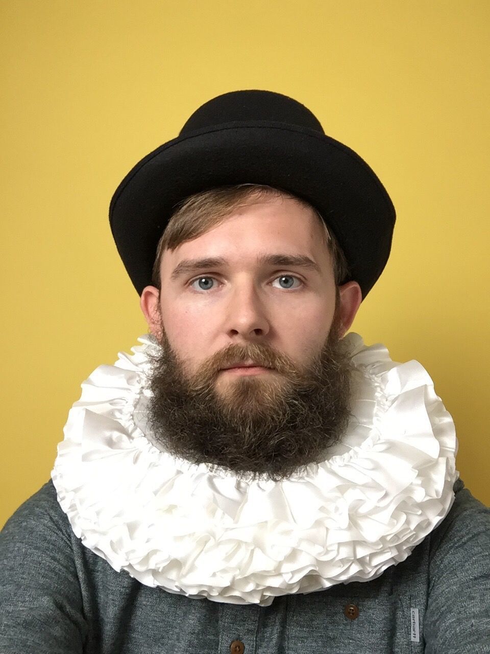 PORTRAIT OF MID ADULT MAN OVER YELLOW BACKGROUND