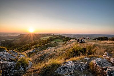 Scenic view of landscape against sky during sunset