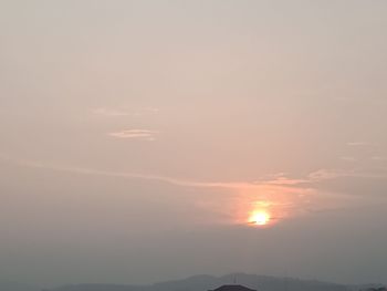 Scenic view of mountains against sky during sunset