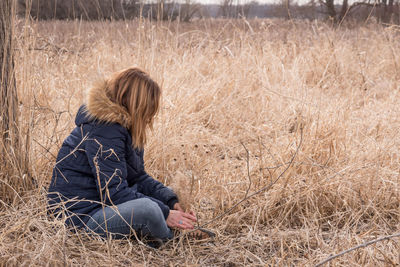 Woman sitting on grass