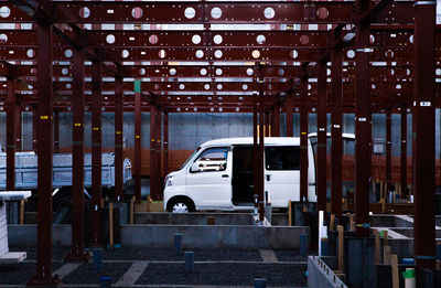 Car parked on street against building in city