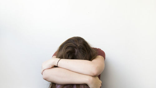 Portrait of woman hand against white background