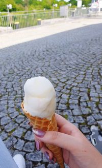 Hand holding ice cream cone