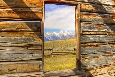 Scenic view of mountains seen from abandoned window