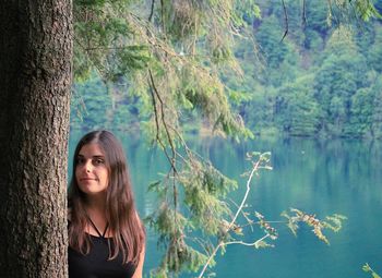 Portrait of young woman in lake