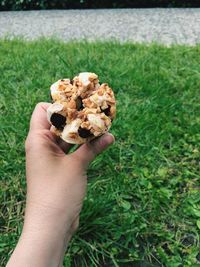 Close-up of hand holding ice cream cone