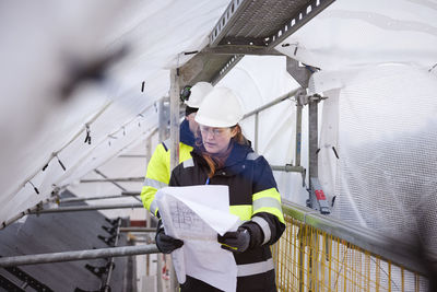 Engineers walking at building site