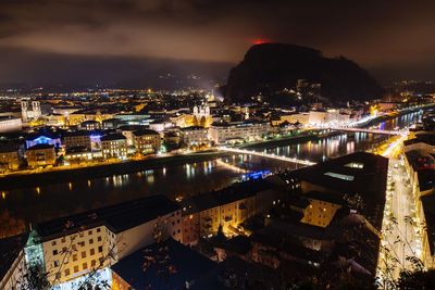 High angle view of illuminated buildings in city at night