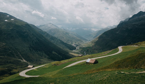 Scenic view of mountains and road against sky