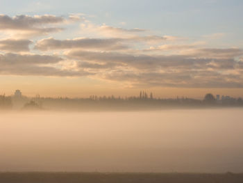 Scenic view of silhouette landscape against sky during sunset